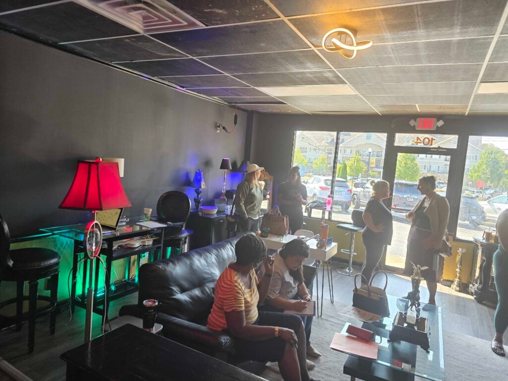 “Women gathering in a casual lounge space, networking and building connections at a Women’s Business Connections event”
