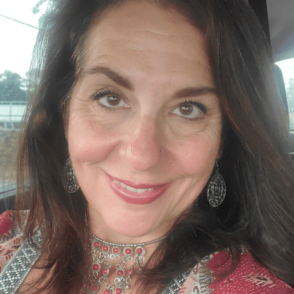 “Smiling woman, representing confidence, authenticity, and women’s empowerment at Women’s Business Connections”